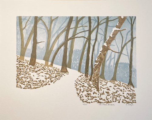 Woodblock print of a landscape in winter with snow covering the ground, bare trees contrast against the white snow while a blue river runs through the center of the composition into the distance. A brown deer stands in the background and a coyote is curled up in the foreground.