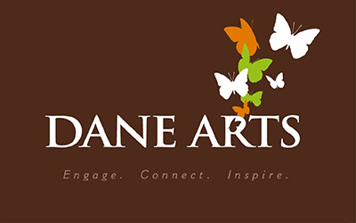 Three color, reverse, one line Dane Arts logo with abbreviated tag line